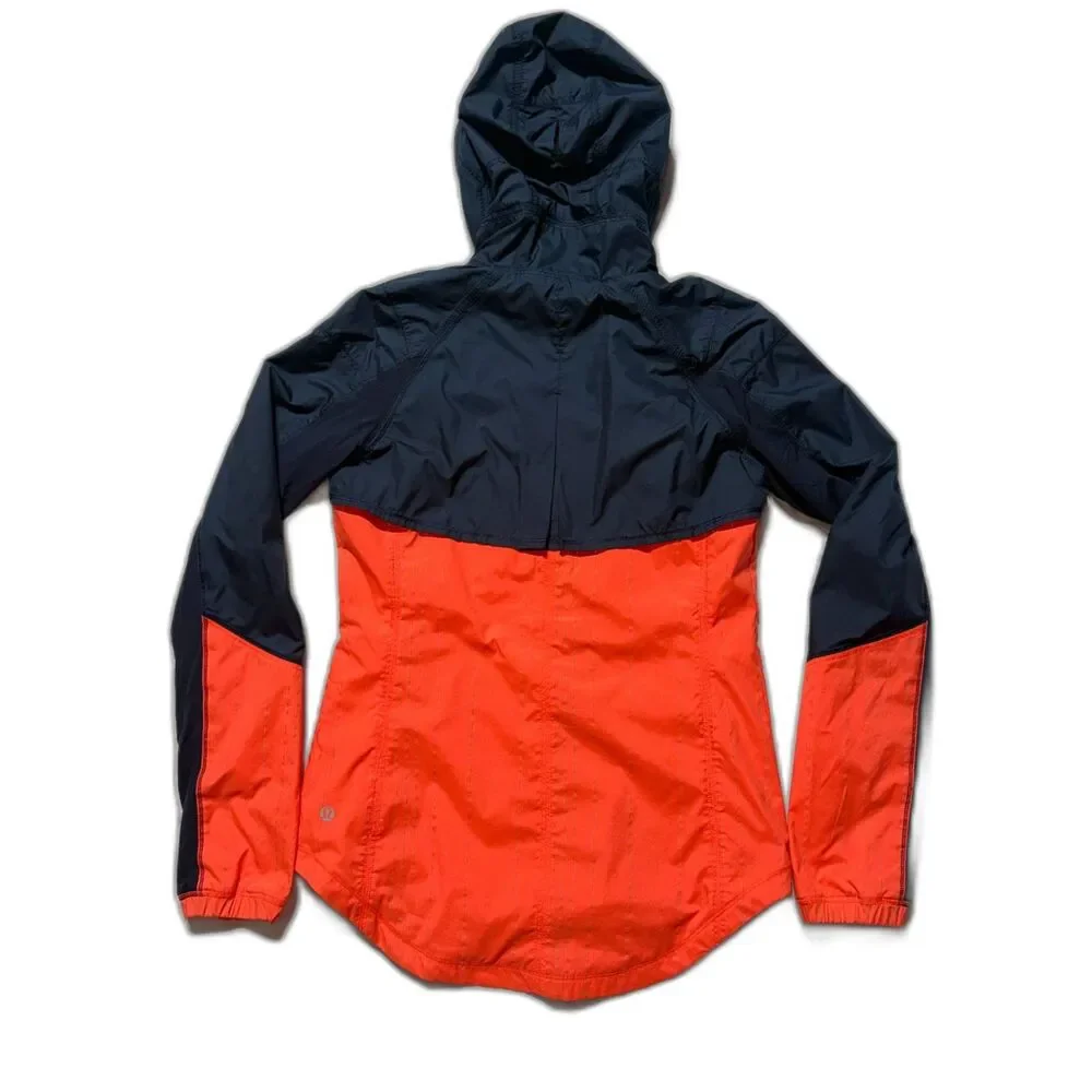 lululemon Get Up & Glow Jacket 4 Orange Navy Reflective Ponytail Hood